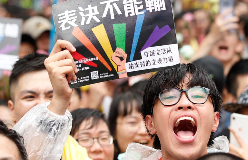A same-sex marriage supporter shouts outside parliament (Photo: Provided)