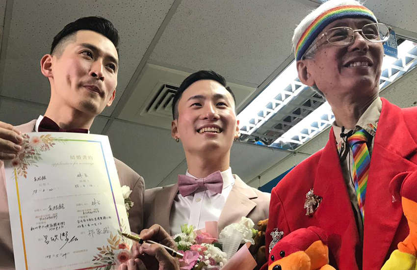 Gay couple Shane and Marc with veteran LGBTI rights campaigner Chi Chia-wei (Photo: Rik Glauert)