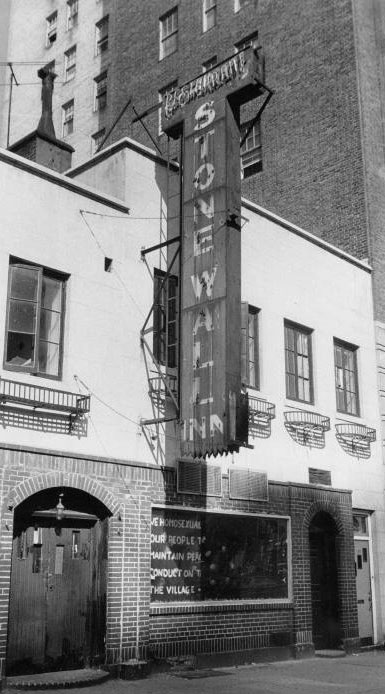 A photo of the Stonewall Inn, showing the Mattachine Society’s sign in the aftermath of the riots.