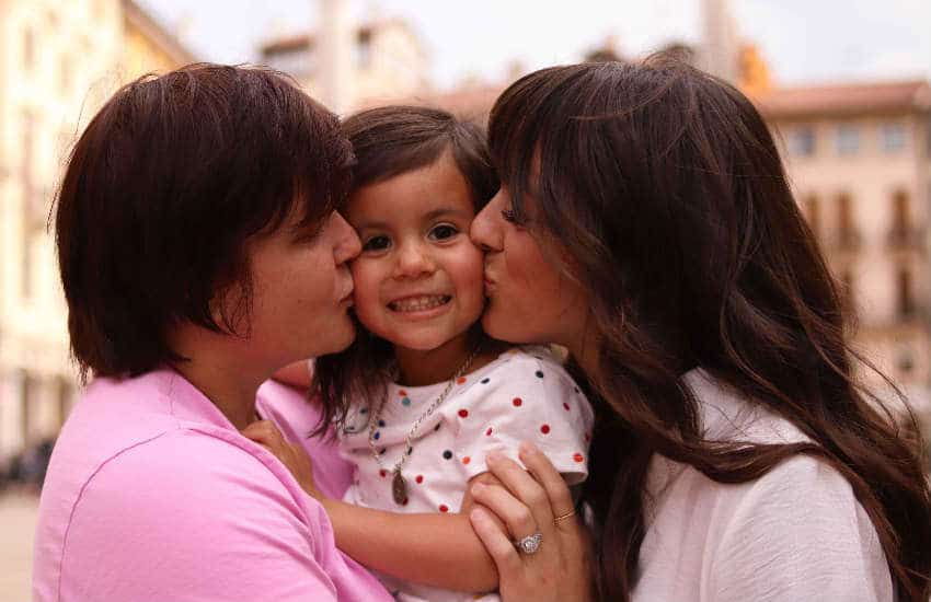 Marine sergeant Ninya Ybarra poses with wife Kayla Ybarra and daughter Annabelle.