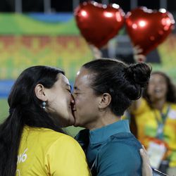 Brazil’s rugby player Isadora Cerullo, right, kissed her partner Marjorie Enya, after getting engaged at the end of the medal ceremony for the women’s rugby sevens match at the Summer Olympics in Rio de Janeiro, Brazil, Monday, Aug. 8, 2016.
