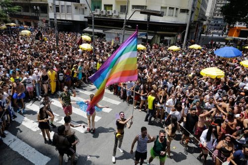 Pride flag being waved at the 2018 Rio de Janeiro carnival pride parade.